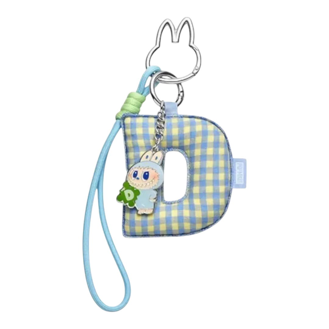 HypeSelection Pop Mart Labubu 'D' letter pendant with blue and yellow gingham fabric, featuring a small character charm.