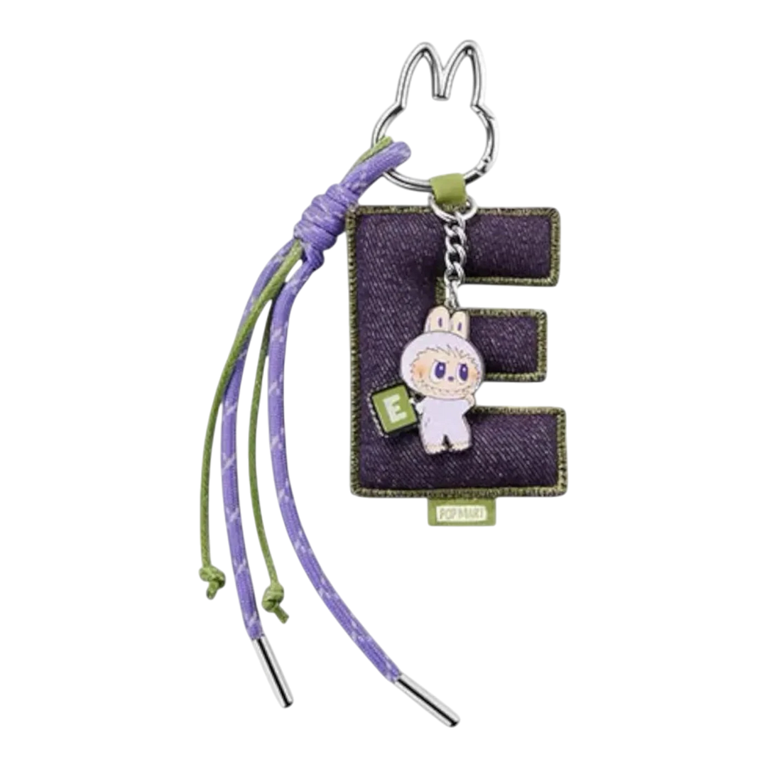 HypeSelection Pop Mart Labubu 'E' letter pendant with purple denim and green accents, featuring a small character charm.