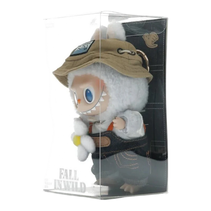 HypeSelection Labubu Fall In Wild plush pendant with vinyl face, wearing denim overalls, bucket hat, and holding a flower.