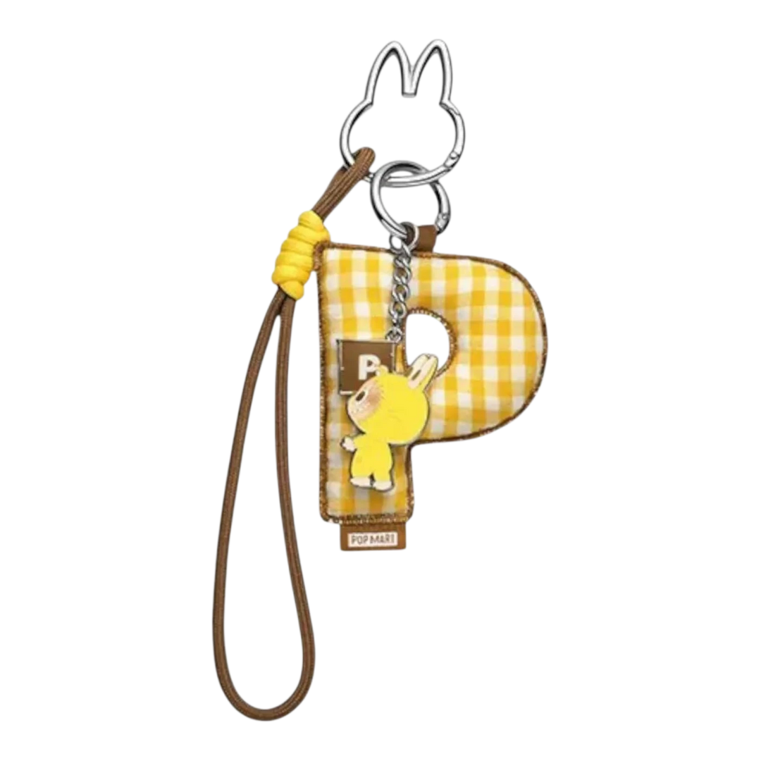 HypeSelection Pop Mart Labubu "P" letter pendant keychain with yellow gingham fabric and a small yellow character charm.
