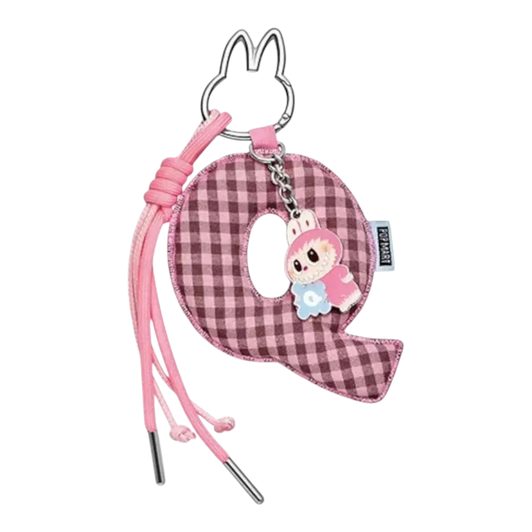 HypeSelection Pop Mart Labubu Q letter pendant, pink gingham fabric with vinyl character charm and pink cord accents.