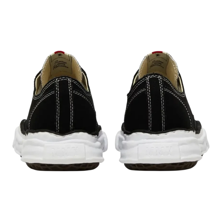 Maison Mihara Yasuhiro Peterson OG Sole black canvas low-top sneakers with white stitching and chunky white rubber sole.