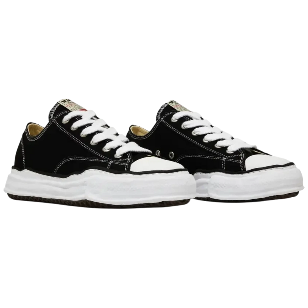 HypeSelection Maison Mihara Yasuhiro Peterson black canvas low-top sneakers with white laces and a chunky, hand-sculpted white rubber sole.