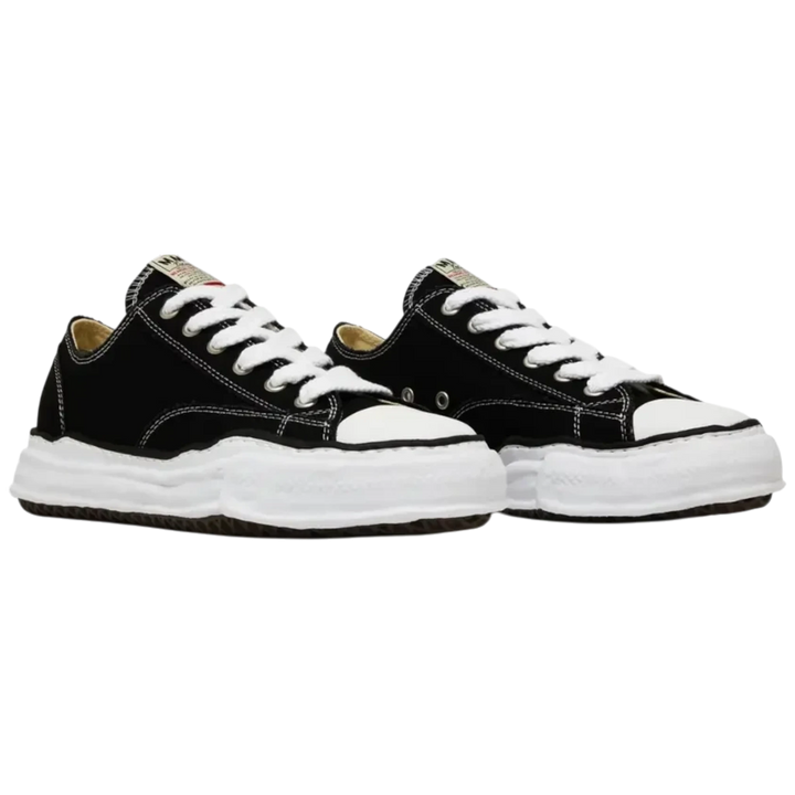 HypeSelection Maison Mihara Yasuhiro Peterson black canvas low-top sneakers with white laces and a chunky, hand-sculpted white rubber sole.