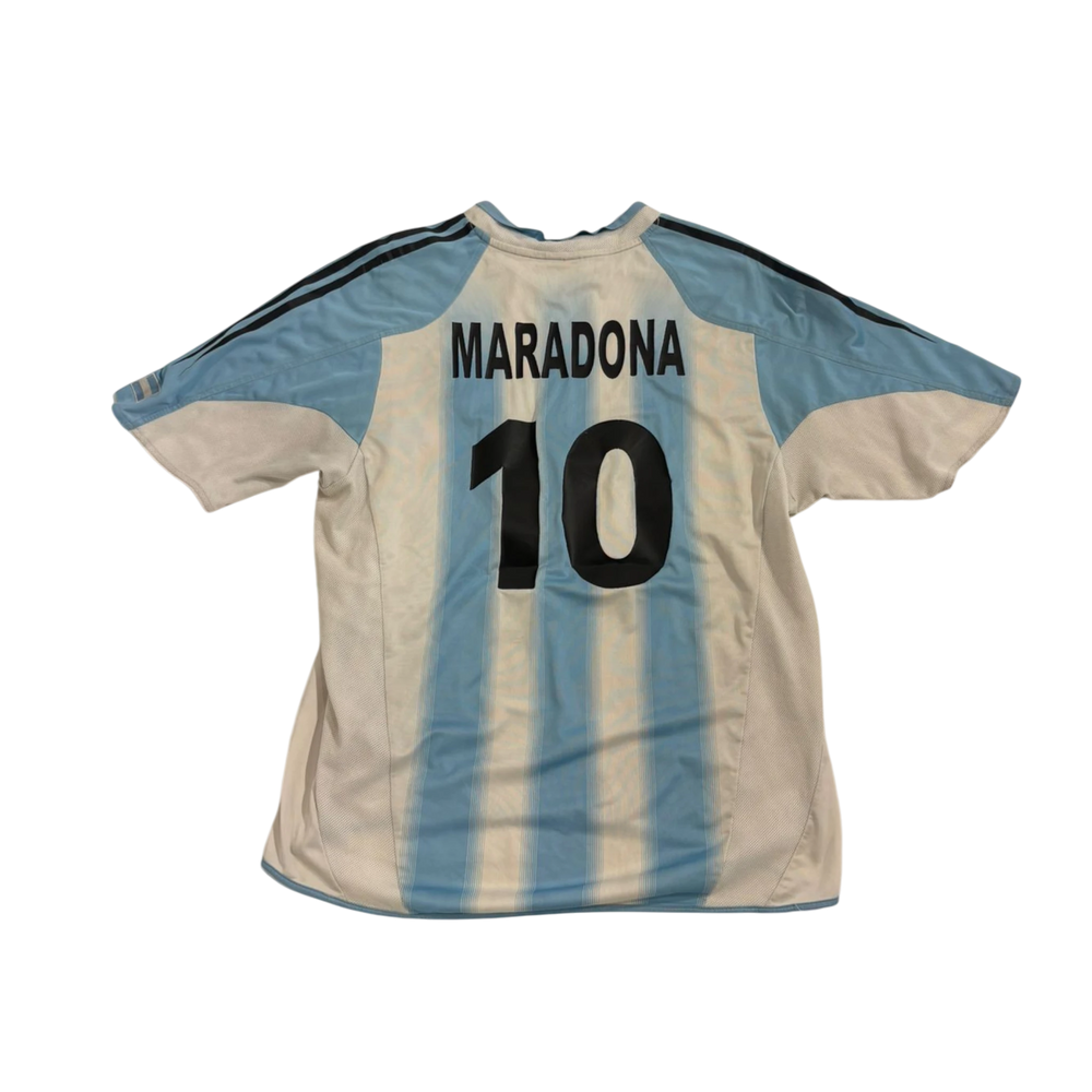 HypeSelection vintage Adidas Argentina football jersey featuring Maradona name and number 10 in blue and white.
