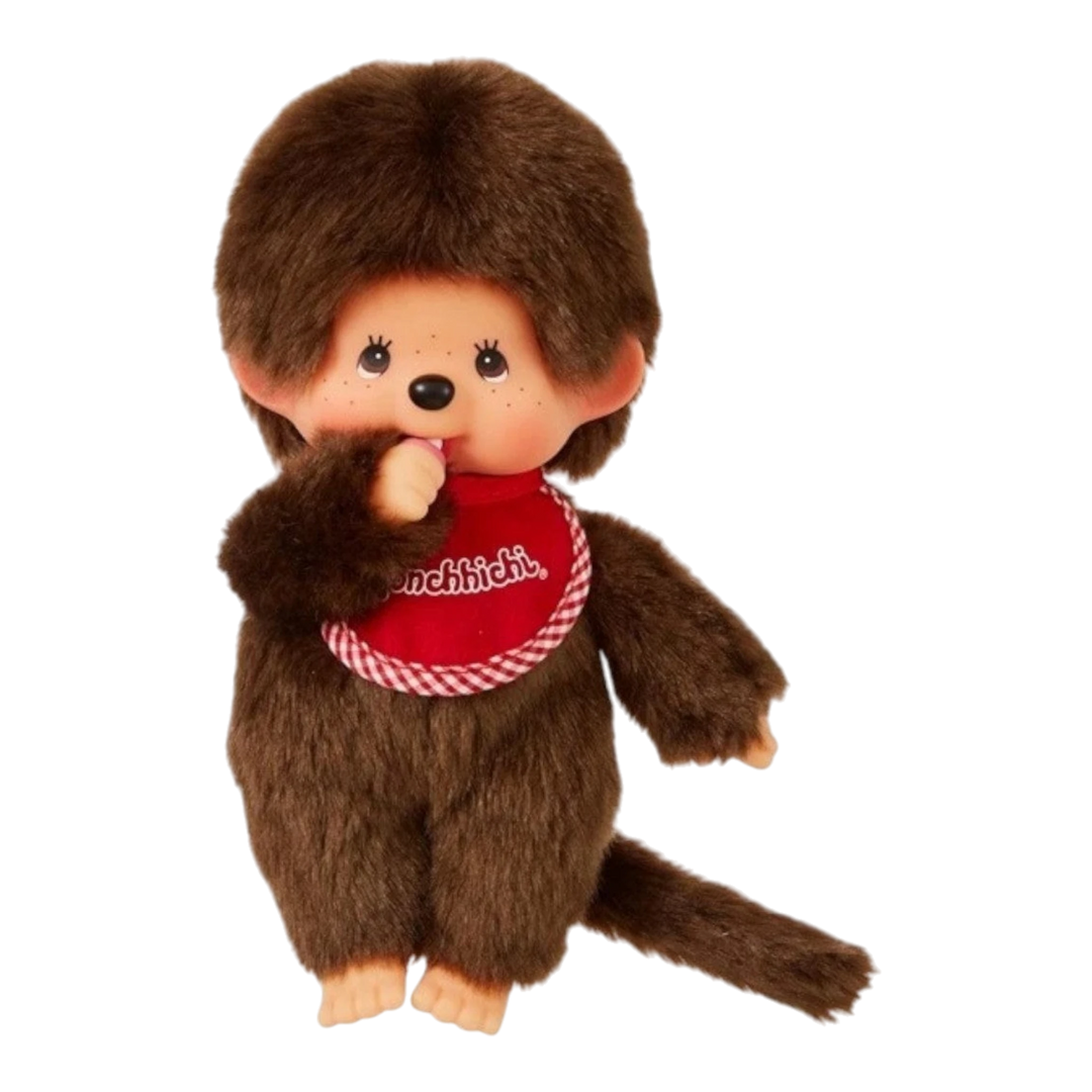 HypeSelection Monchhichi Classic Boy S doll, brown plush with red bib, thumb-sucking pose.