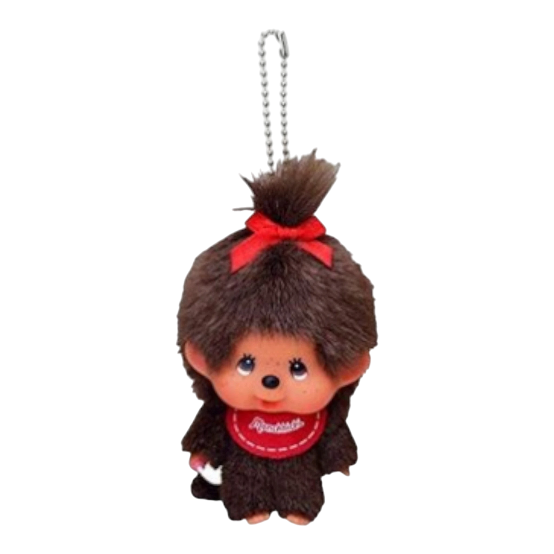 HypeSelection Monchhichi girl keychain with big face, brown plush fur, red bow, and red bib.