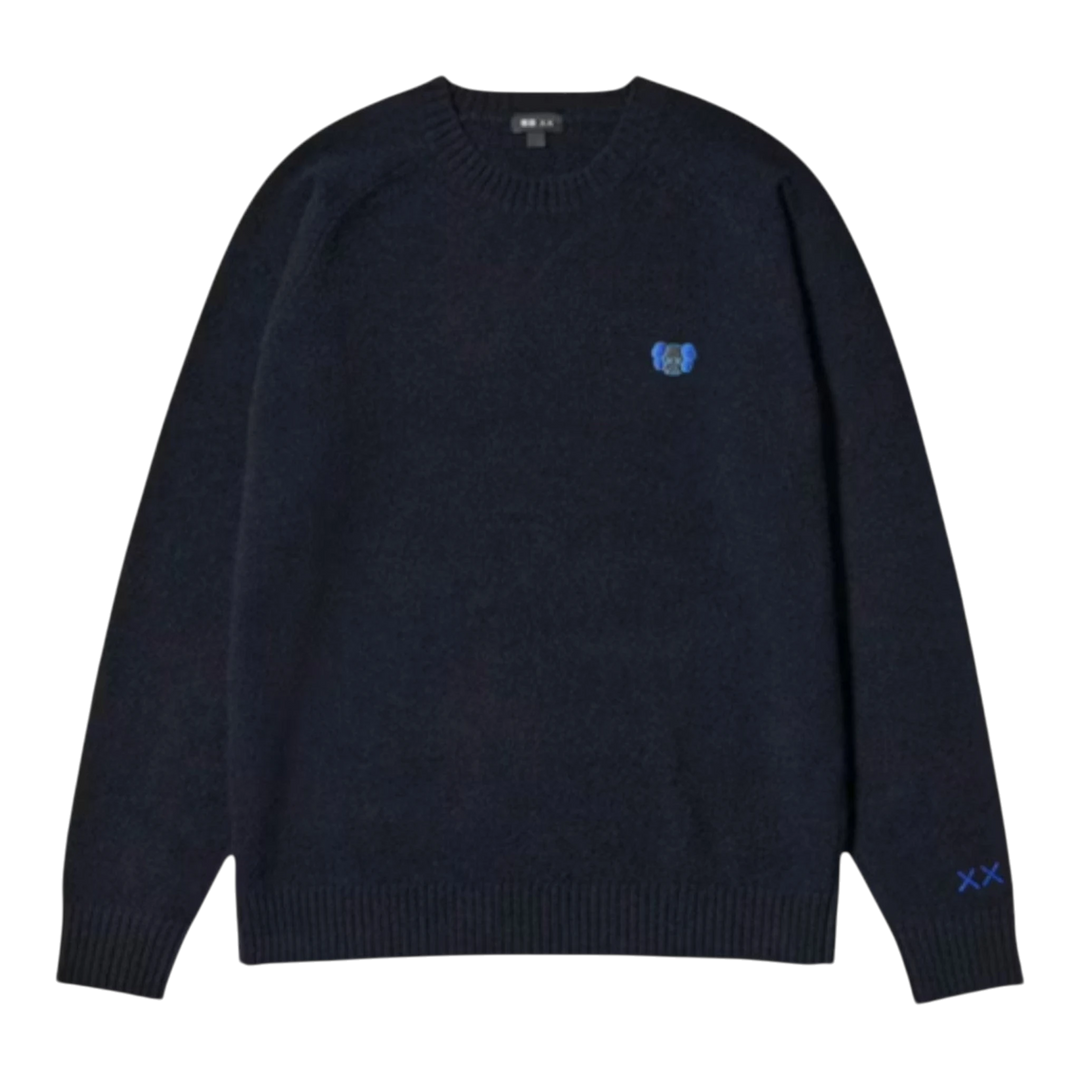 HypeSelection navy blue 100% lambswool crew neck sweater with embroidered KAWS motifs on chest and sleeve.