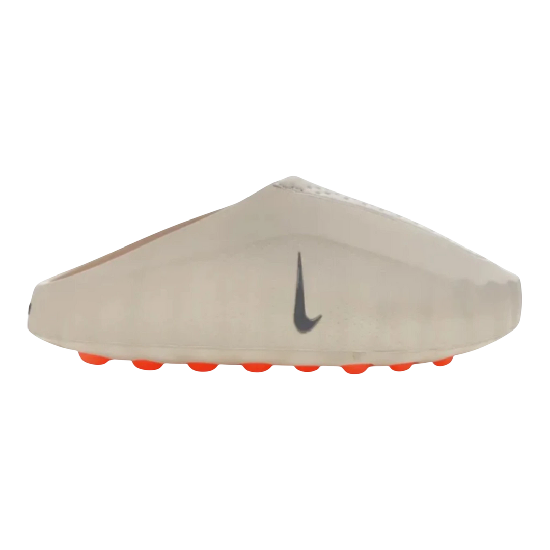 Nike Mind 001 slide in light bone with a grey swoosh logo and orange sole details. Unisex slip-on design.