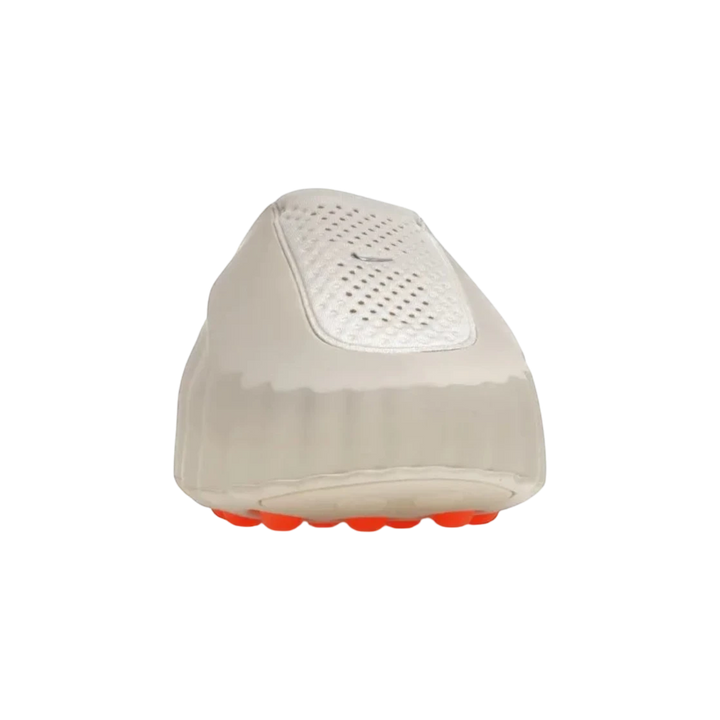 Nike Mind 001 Light Bone slide with perforated top and orange sole detail. Unisex foam recovery sandal.
