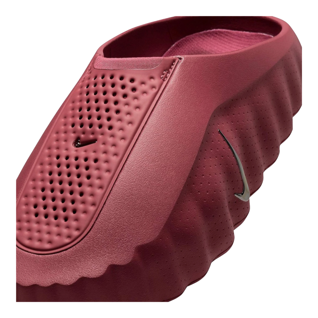 HypeSelection Nike Mind 001 slide in Pink Smoke featuring a sculpted foam silhouette and metallic silver swoosh detail.