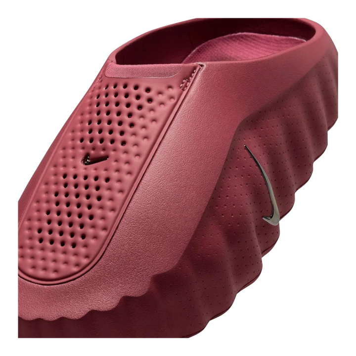 HypeSelection Nike Mind 001 slide in Pink Smoke featuring a sculpted foam silhouette and metallic silver swoosh detail.