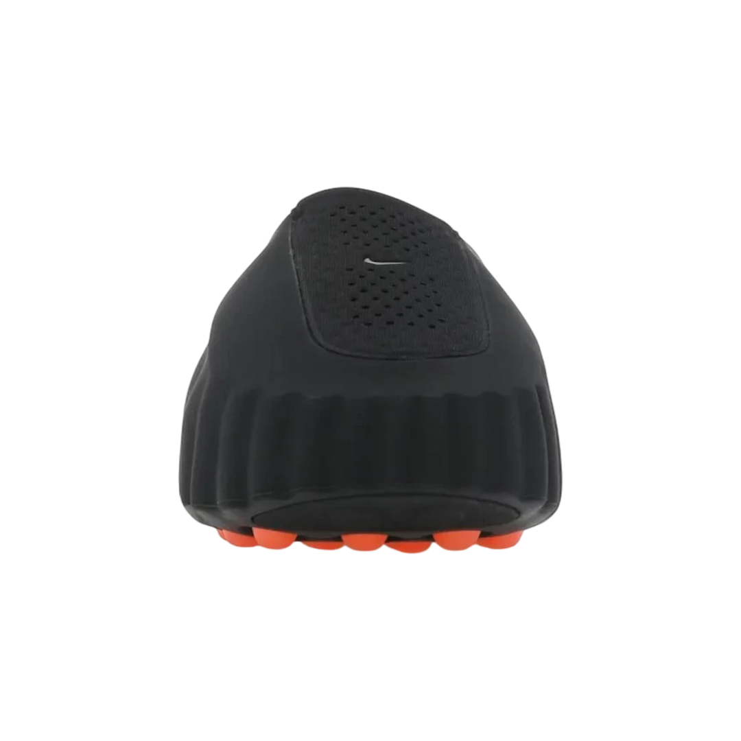 HypeSelection Nike Mind 001 Slide in black foam with a reflective chrome Swoosh and orange traction pods on the sole.