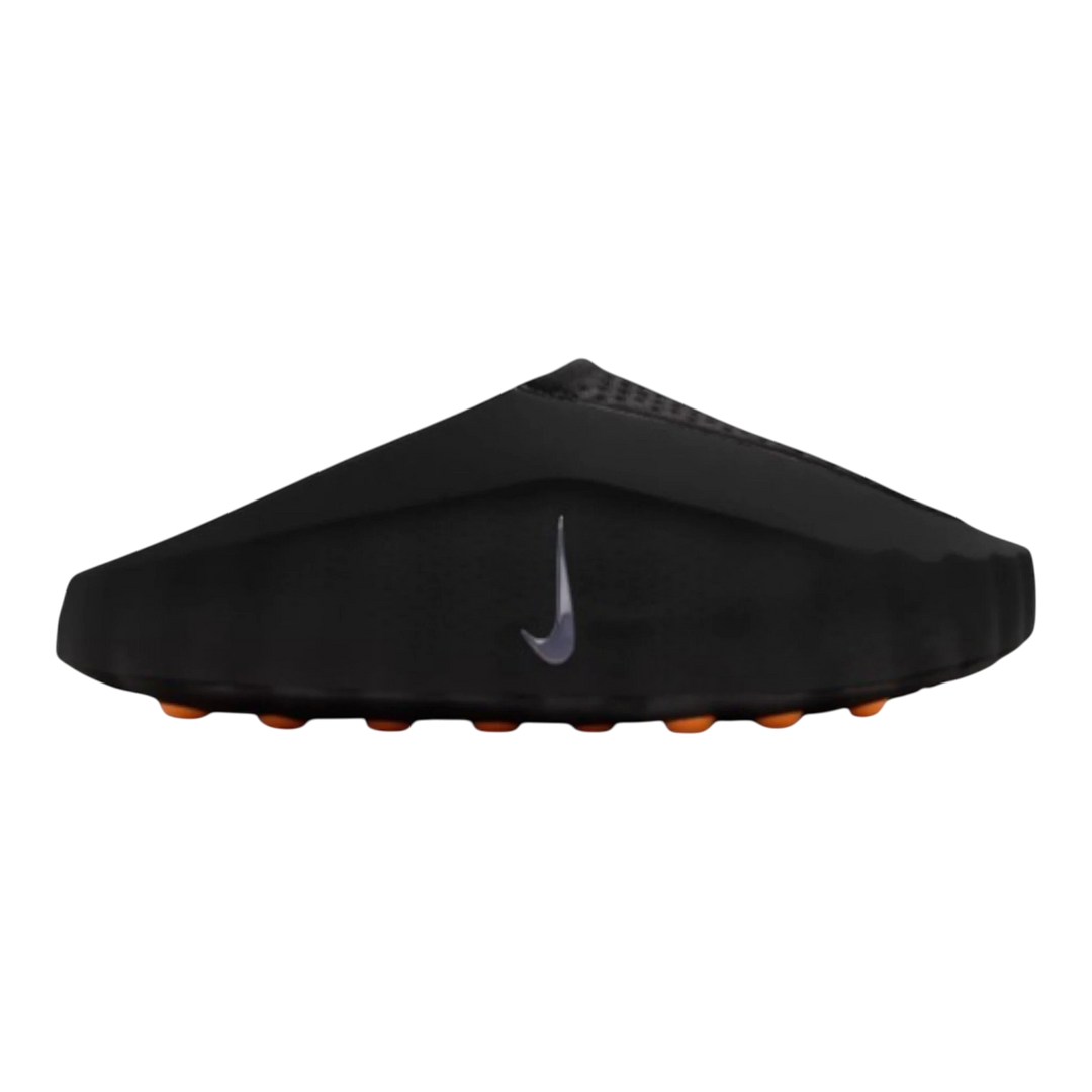 Nike Mind 001 Slide in black with chrome Swoosh detail and orange sole pods. Women's slip-on mule style.