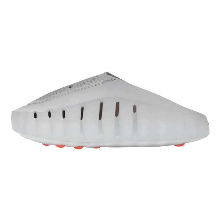 Nike Mind 001 Slide in Light Smoke Grey, a foam-based slip-on with a sculpted silhouette and orange traction pods.