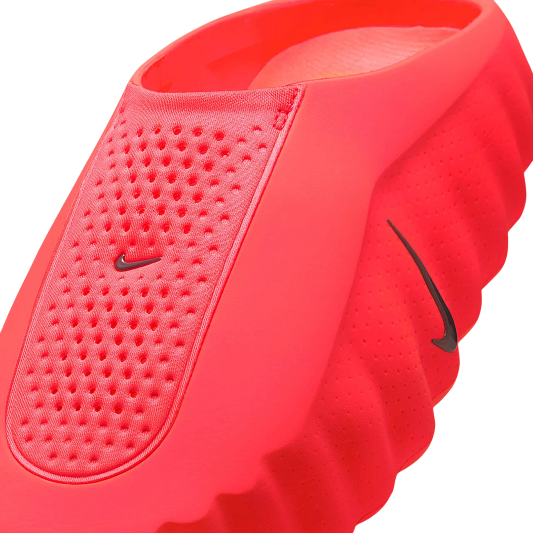 HypeSelection Nike Mind 001 Slide in vibrant Solar Red, featuring a one-piece foam construction with perforated details and a sculpted outsole.
