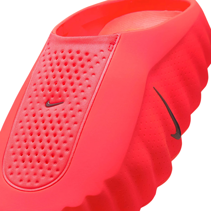 HypeSelection Nike Mind 001 Slide in vibrant Solar Red, featuring a one-piece foam construction with perforated details and a sculpted outsole.