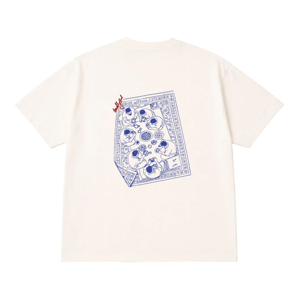HypeSelection off-white cotton t-shirt with a blue graphic print of people sharing a meal on a rug.