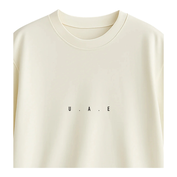 HypeSelection off-white terry cotton oversized t-shirt with minimalist "U.A.E." print on chest.