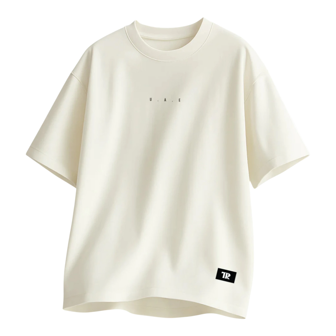 HypeSelection Off-White terry cotton oversized tee with subtle "UAE" print and "TR" logo tag.
