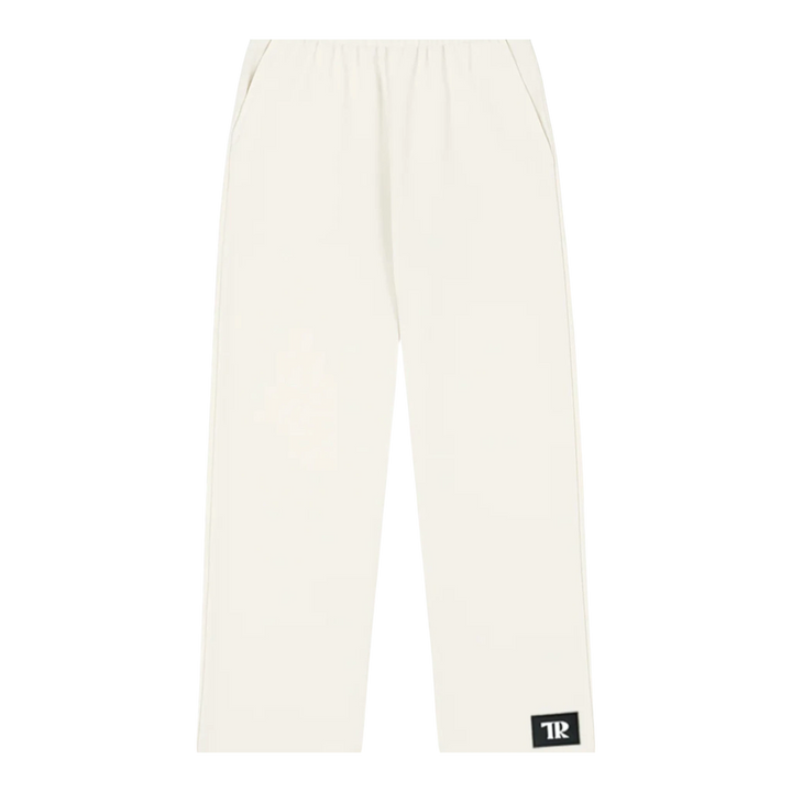 HypeSelection off-white wide-leg sweatpants made from a cotton blend fabric with an elastic waistband and side pockets.