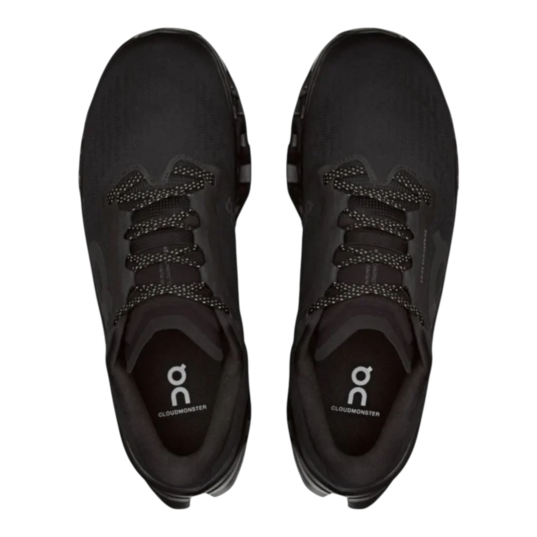 HypeSelection On Cloudmonster 3 running shoes in all-black featuring an engineered mesh upper and top-down view.