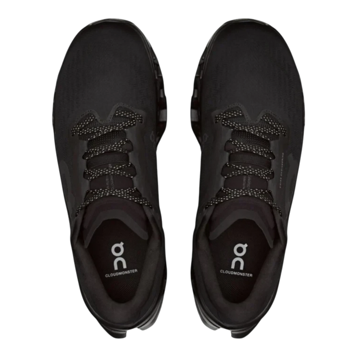 HypeSelection On Cloudmonster 3 running shoes in all-black featuring an engineered mesh upper and top-down view.