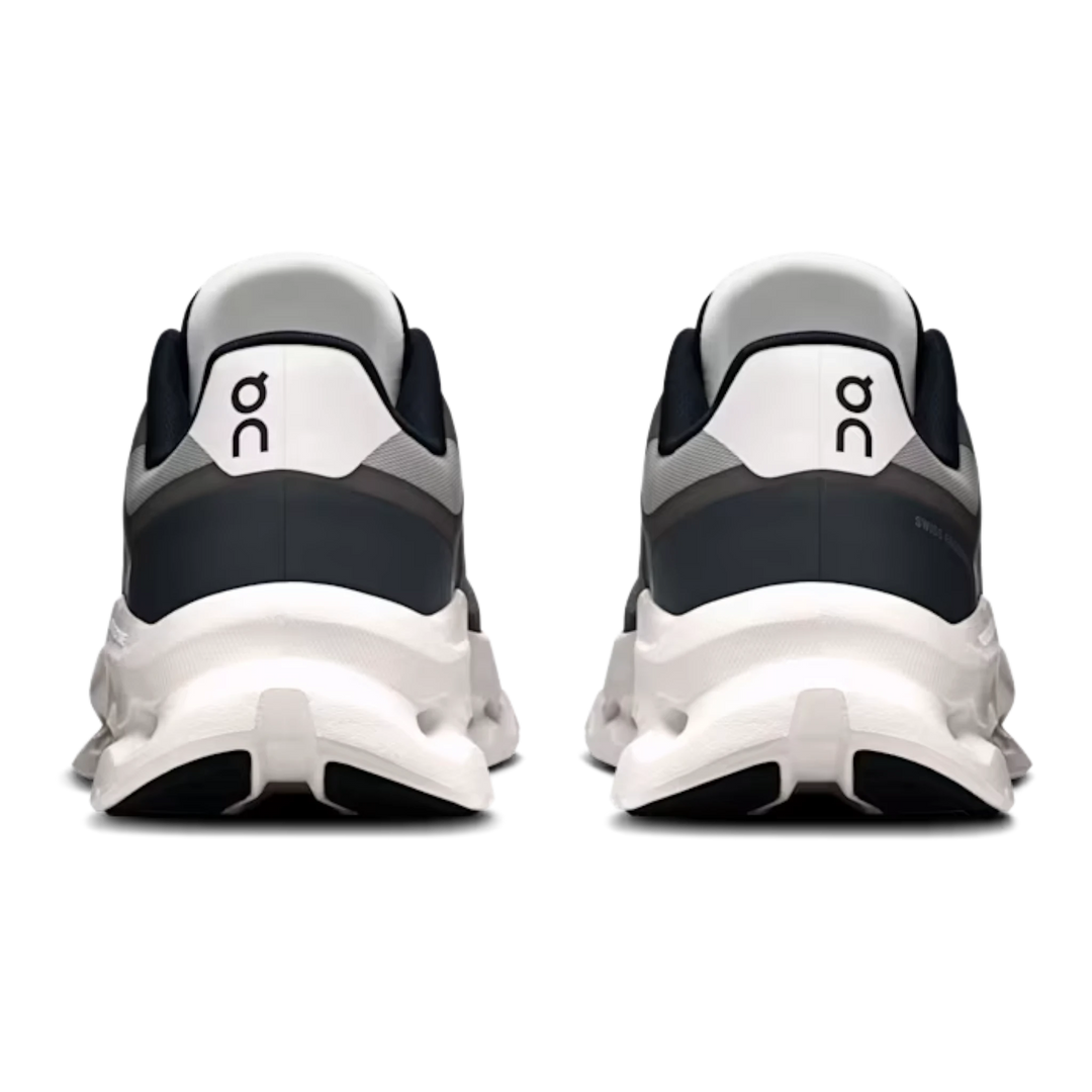 HypeSelection On Cloudtilt Remix sneakers in black and ivory, showing the rear view with sculpted white midsole pods.