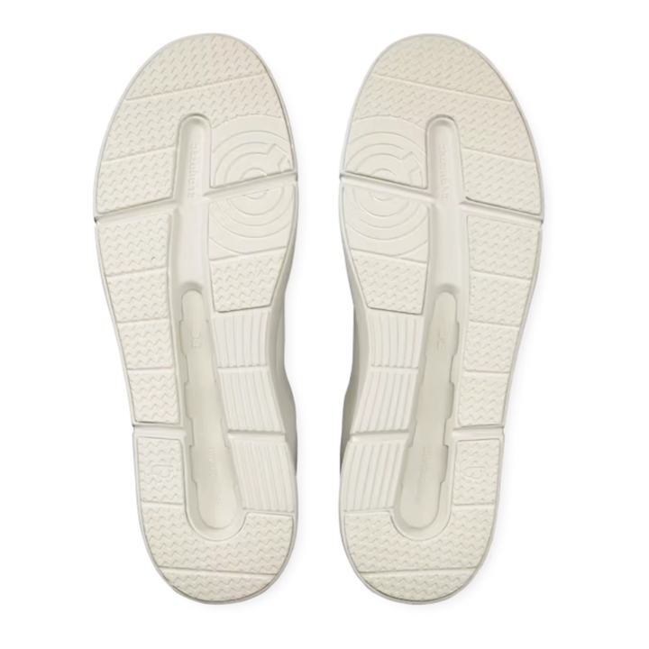 HypeSelection On THE ROGER Advantage white sneakers showing the textured CloudTec rubber outsoles from below