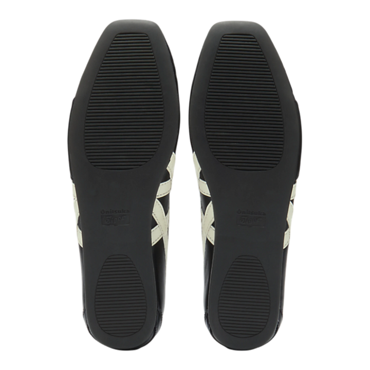 HypeSelection Onitsuka Tiger GYMNARINA ballet-inspired shoes in black and cream, showing the textured rubber outsoles.