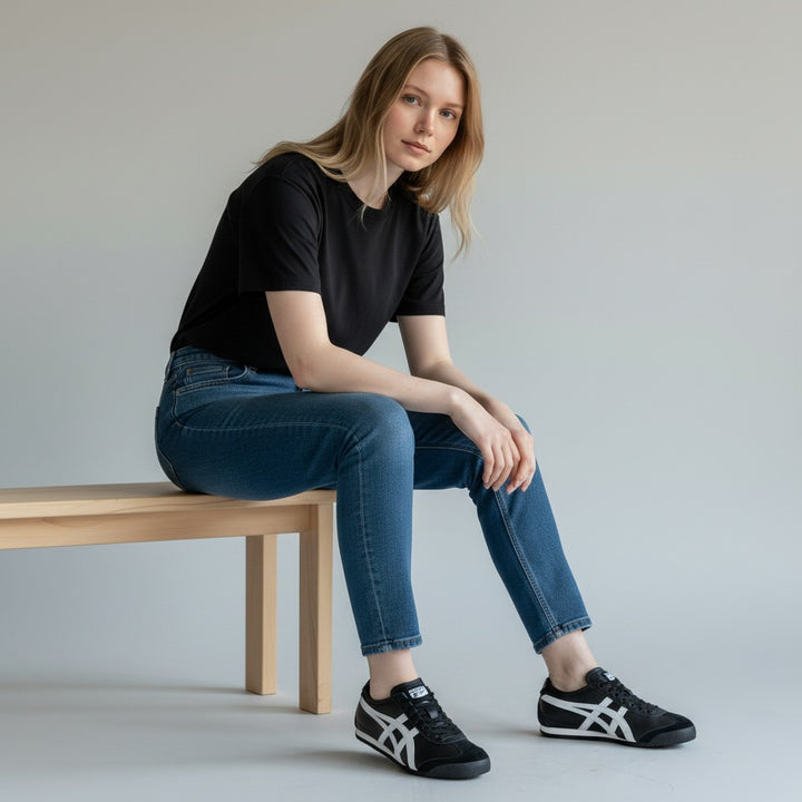 HypeSelection Onitsuka Tiger Mexico 66 black and white leather and suede sneakers with signature stripes.