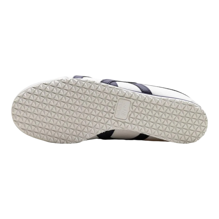 HypeSelection Onitsuka Tiger Mexico 66 Slip-On sneaker showing the textured rubber outsole in birch and midnight