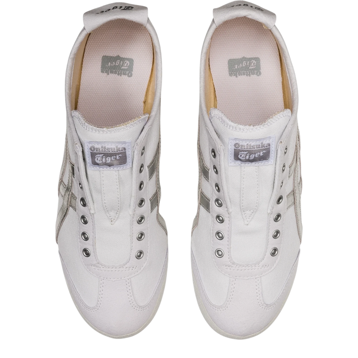 HypeSelection Onitsuka Tiger Mexico 66 slip-on sneakers in white canvas with metallic silver stripes, top-down view.