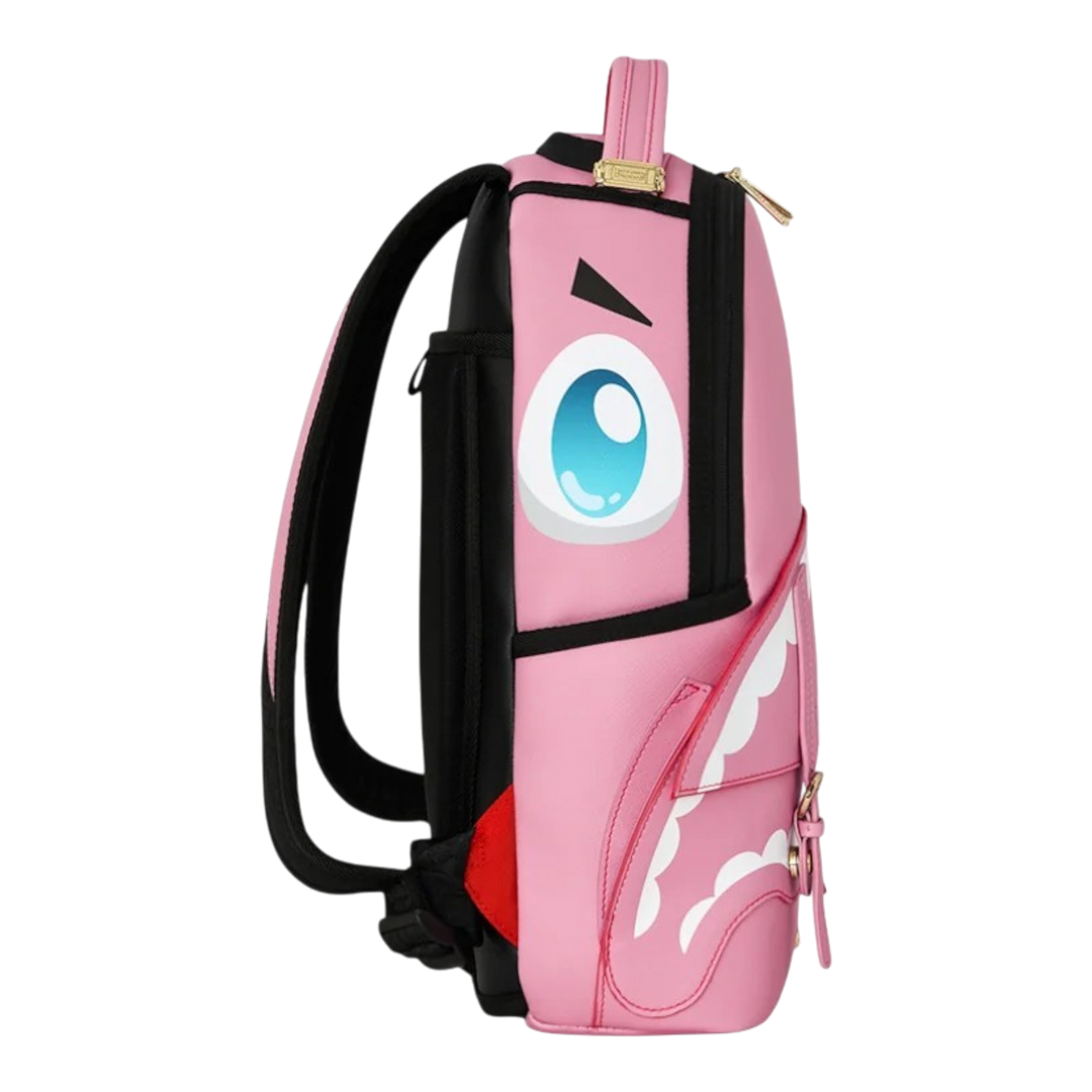 HypeSelection pink PVC Sprayground Kawaii mini backpack with side view of sharkmouth pocket and anime eye graphic