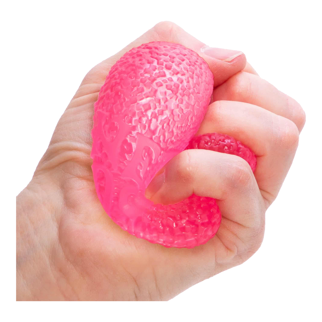 HypeSelection pink NeeDoh Gumdrop sensory fidget toy with a textured, jelly-filled surface being squeezed in a hand.