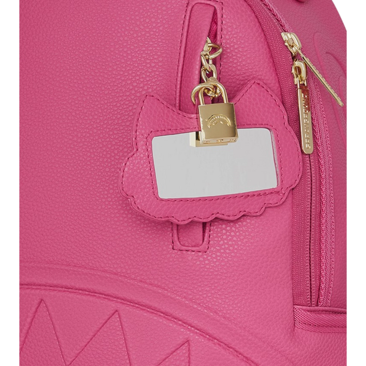 HypeSelection Sprayground Shark Pink Attack backpack with gold hardware, shark mouth detail, and a cat-shaped tag with a lock.