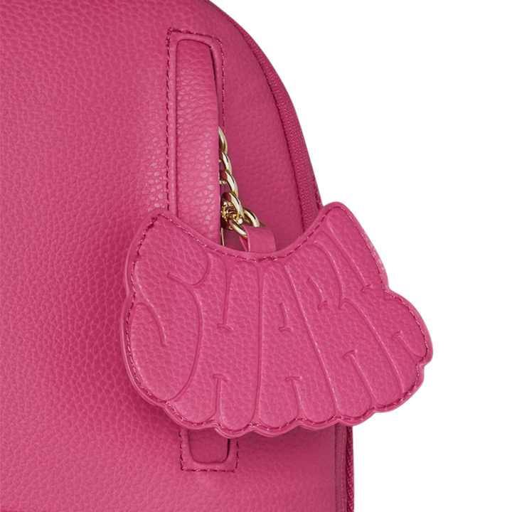 HypeSelection pink PVC backpack with iconic shark mouth design and gold chain detail.