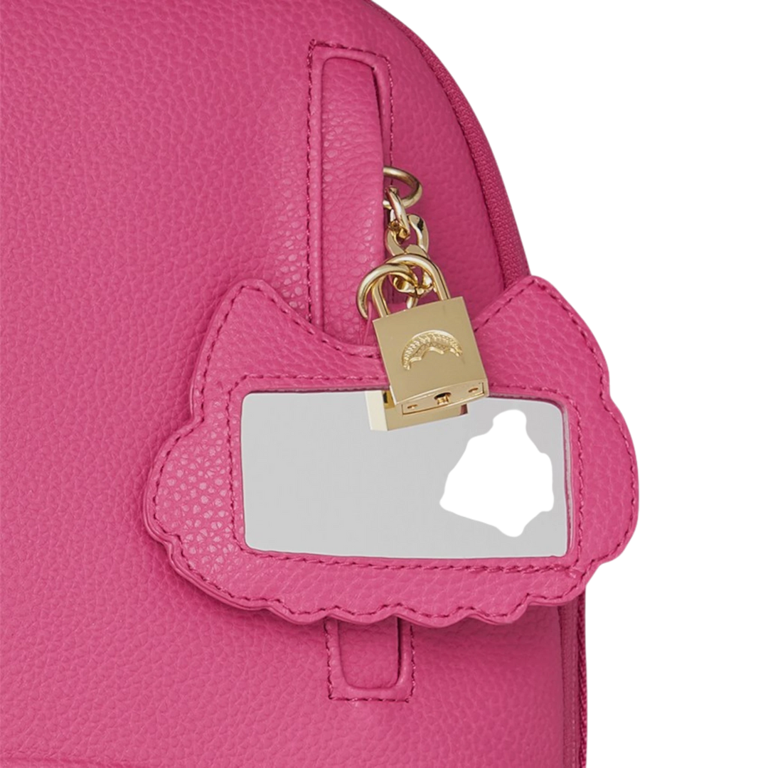 HypeSelection Sprayground pink PVC backpack with gold lock and shark detail on luggage tag.