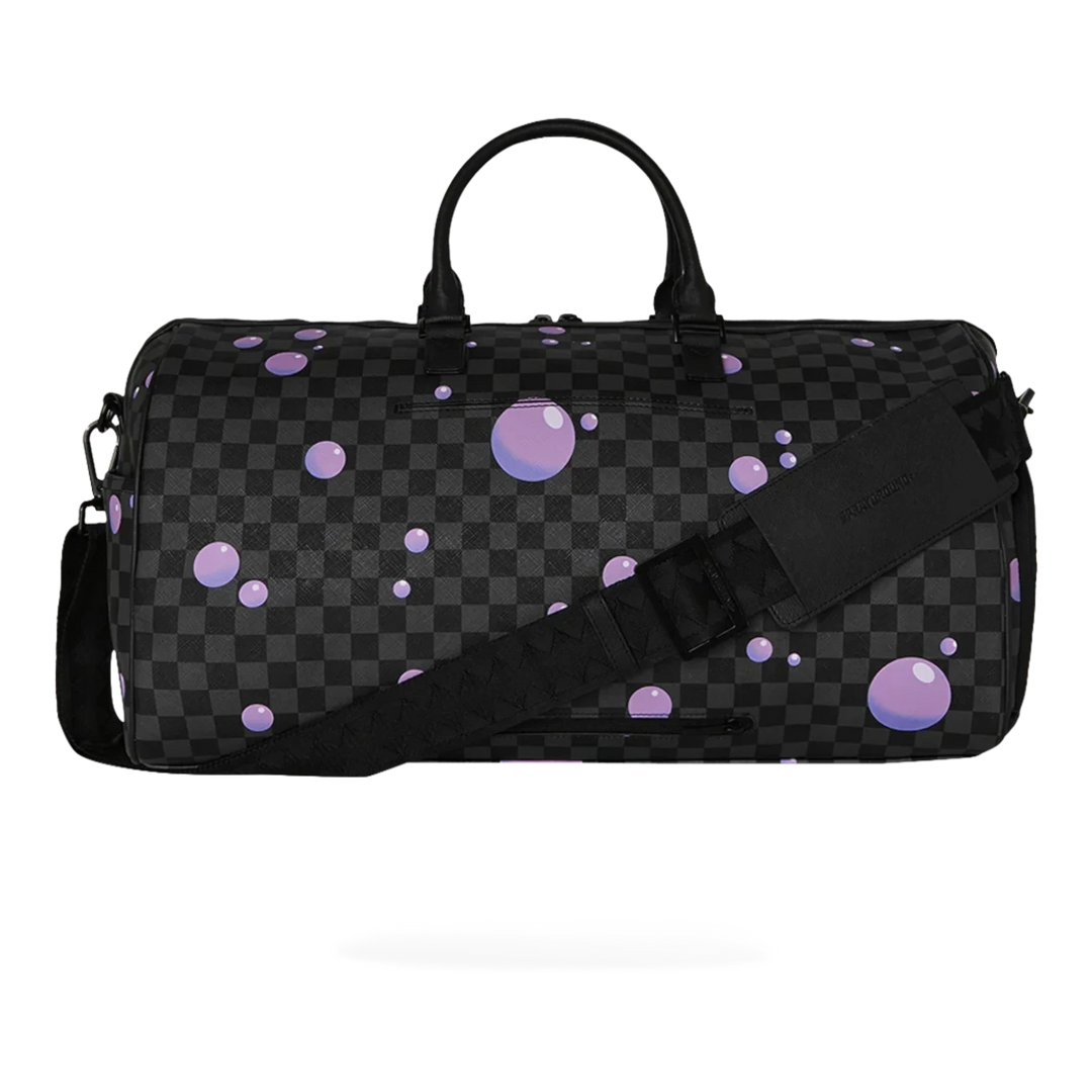 HypeSelection Purple Slime Takeover duffle bag with checkered pattern and purple bubble accents. Faux leather.