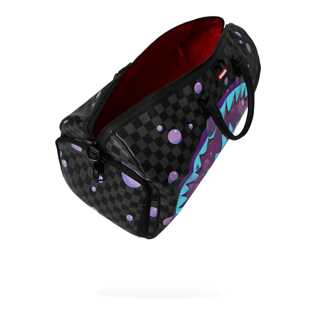 HypeSelection Purple Slime Takeover duffle bag with black checkerboard pattern, purple slime drips, and shark graphic.