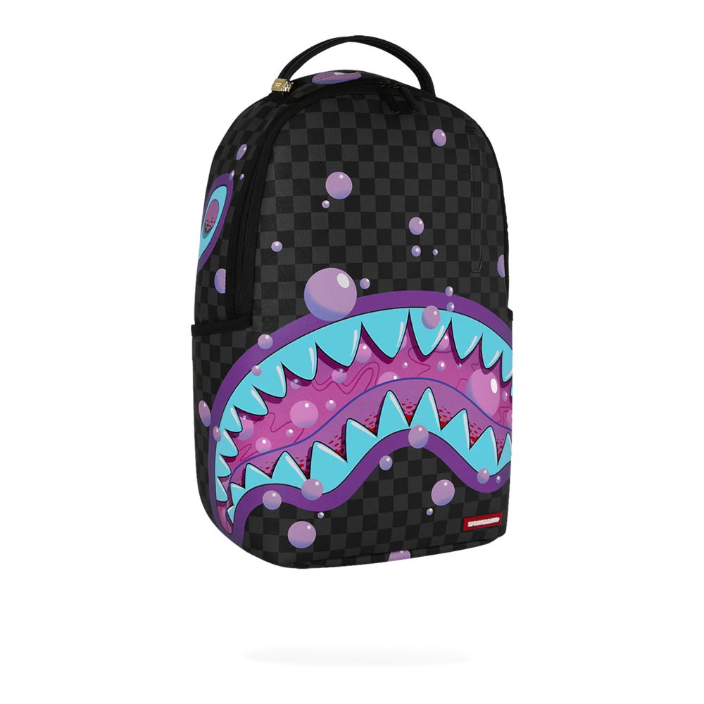 HypeSelection Sprayground Purple Slime Takeover backpack with shark mouth graphic on checkered black PVC material.
