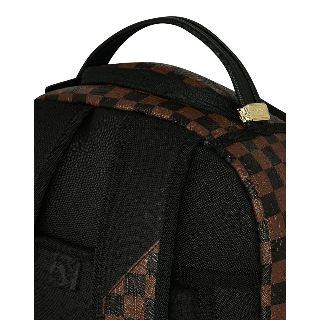 HypeSelection Sprayground Shredded Money DLXSV backpack featuring a black and brown checkered pattern and gold zipper