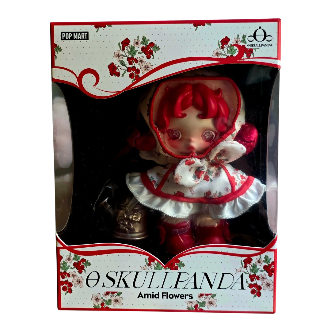 HypeSelection SKULLPANDA Amid Flowers plush doll pendant with red hair, floral dress, and red hood. Vinyl face detail.