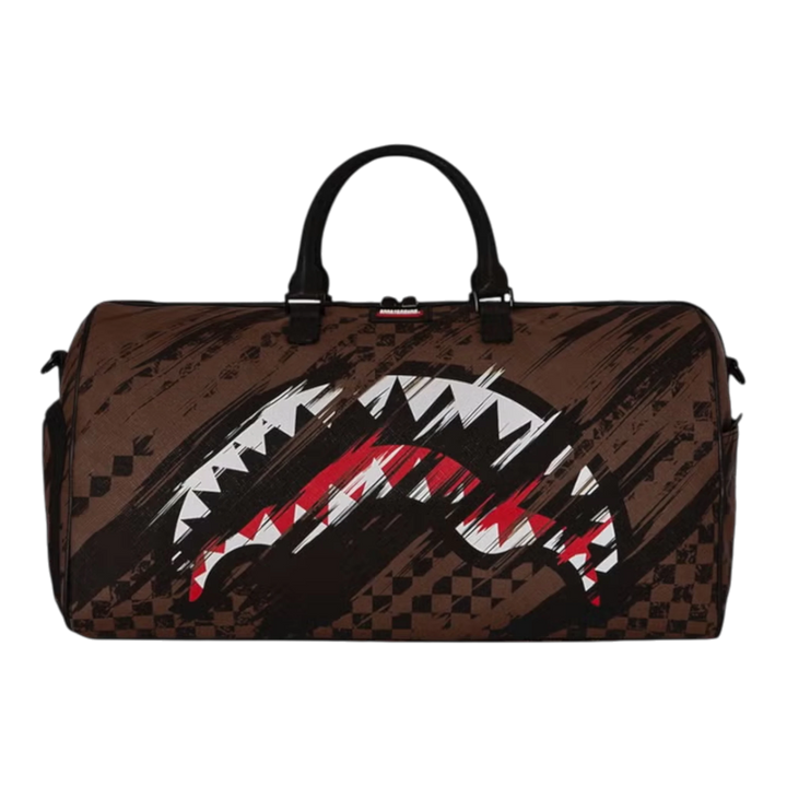 HypeSelection SMEARED GRUNGE DUFFLE: Brown PVC duffle bag with distressed paint-smear pattern and iconic shark graphic. Multiple pockets and carry options.