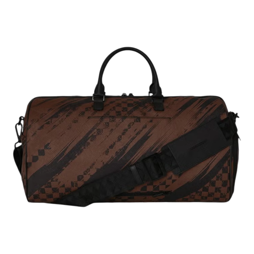 HypeSelection brown duffle bag with smeared grunge pattern and black accents. Features top handles and a detachable shoulder strap.