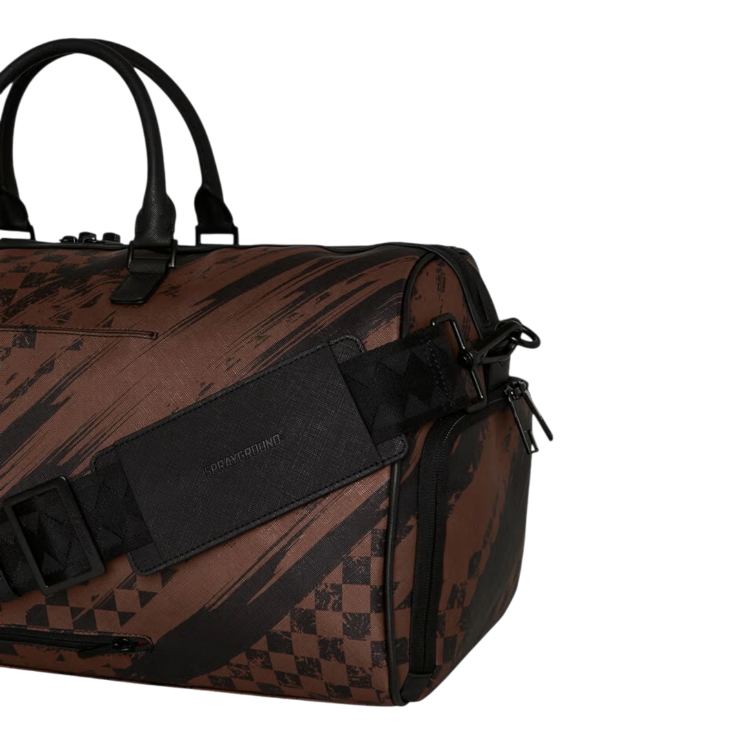 HypeSelection brown PVC duffle bag with smeared grunge pattern and black hardware. Features adjustable strap and zip pockets.