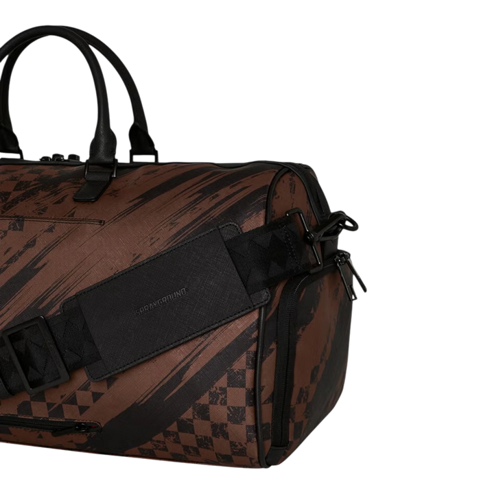 HypeSelection brown PVC duffle bag with smeared grunge pattern and black hardware. Features adjustable strap and zip pockets.
