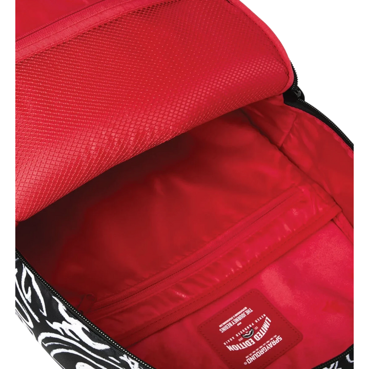 HypeSelection Sprayground Crazy Thoughts DLXSR backpack interior with vibrant red lining and zippered pocket