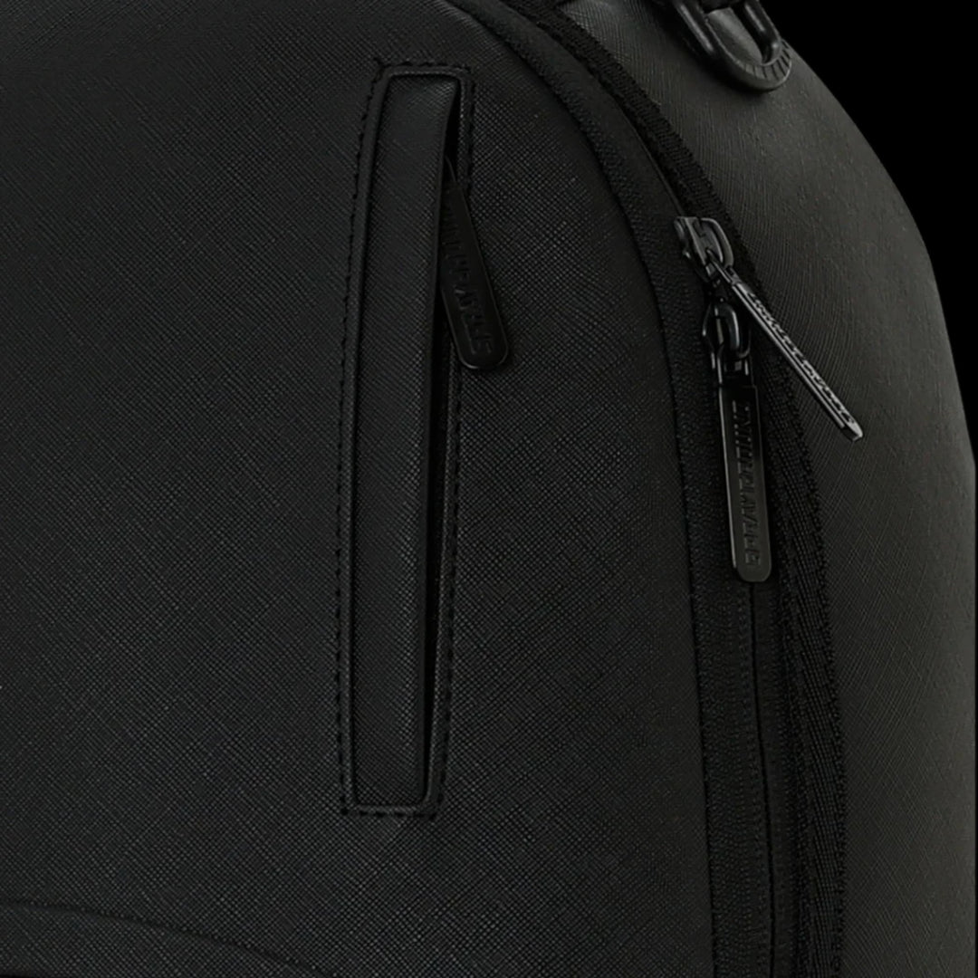 HypeSelection Sprayground blacked out backpack featuring textured material and branded zipper pulls