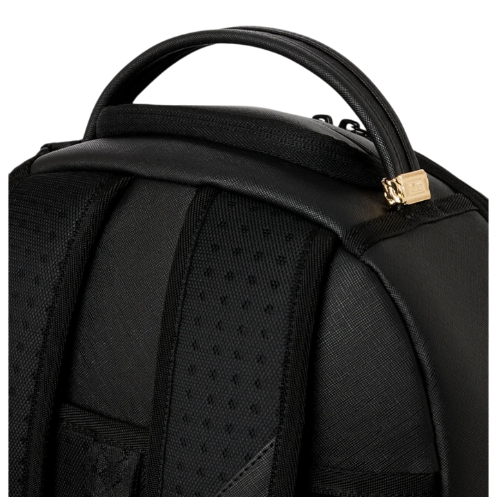 HypeSelection Sprayground black backpack with top handle and gold tooth detail on the zipper pull
